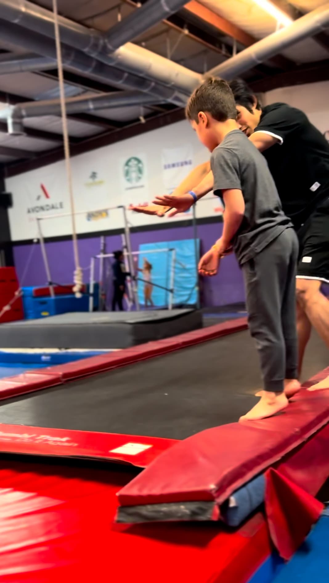 DFDub coach spotting athlete during tricking class in Grapevine TX